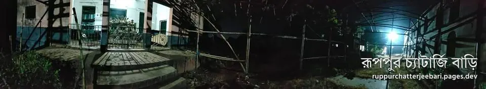 Ma aschen: the bamboo frame going up at the Durga temple at night (photo: Admin Achinta)