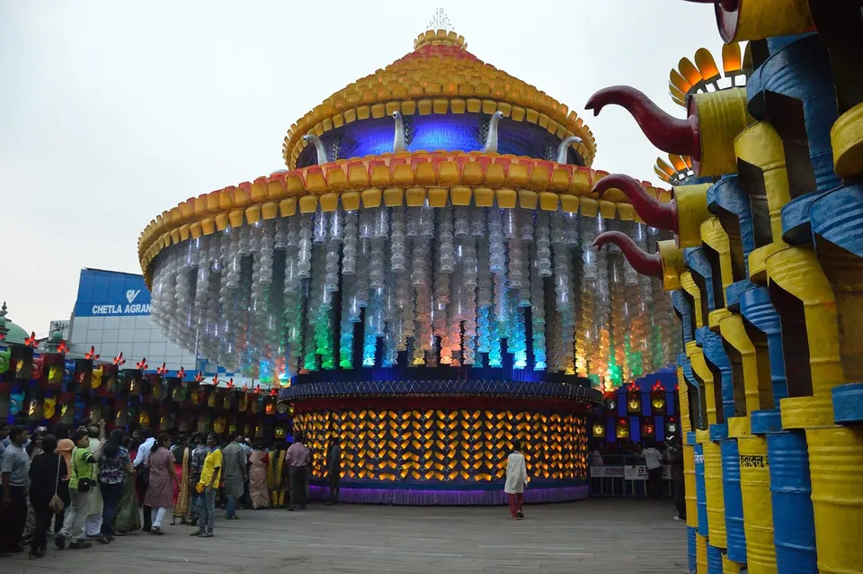 Crowds outside a brightly decorated theme pandal at Chetla Agrani Club, Kolkata