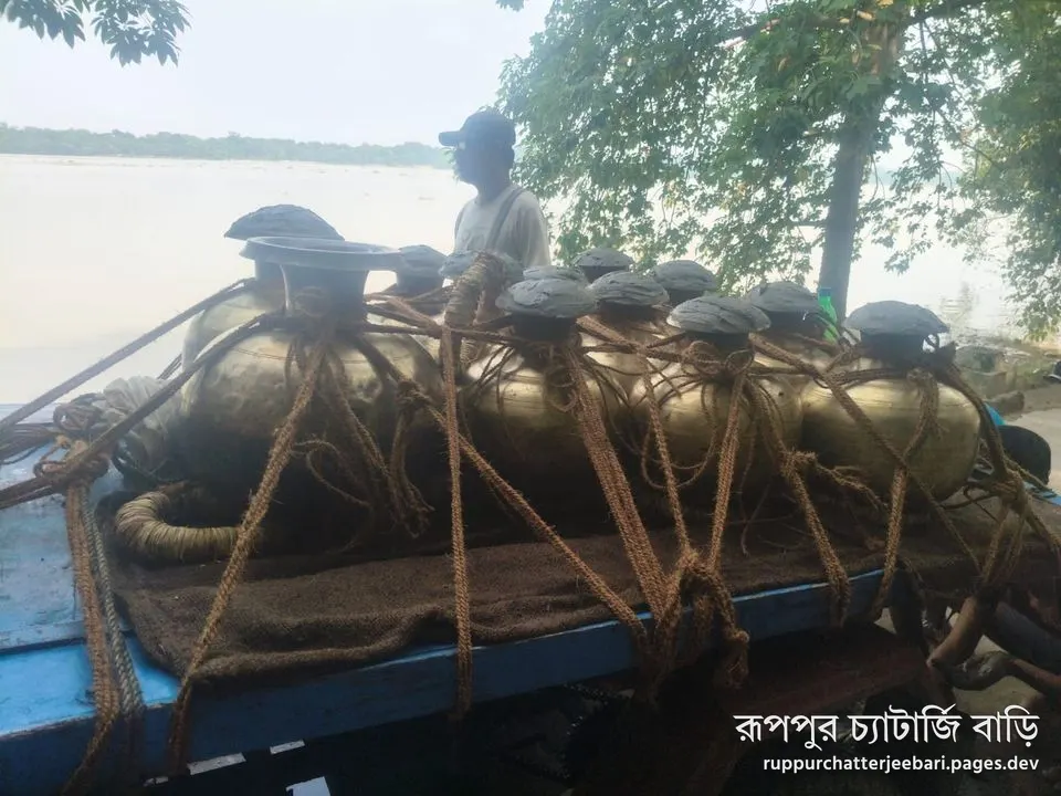 The kolshis of Ganga jol tied onto the cart at the ghat on Mahalaya (photo: Debajyoti)